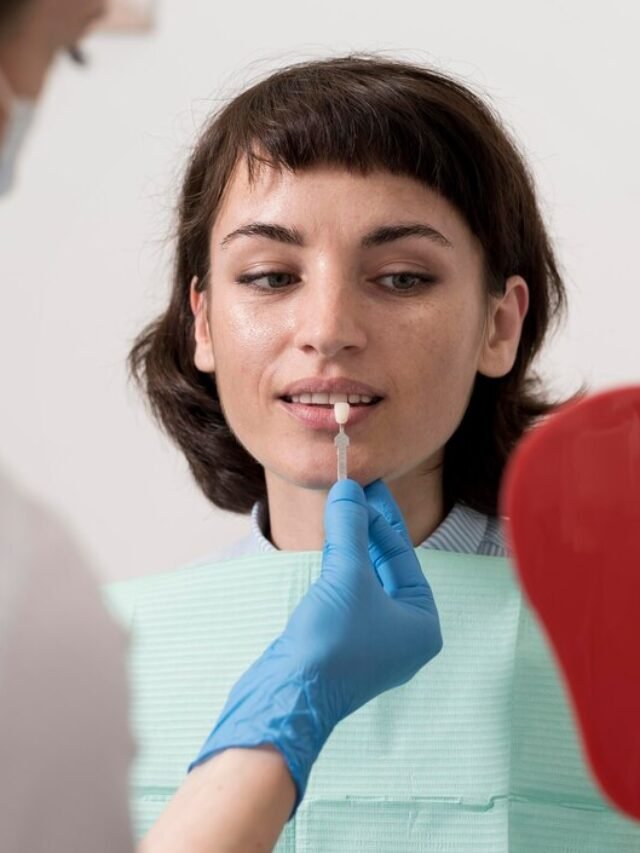 female-patient-looking-mirror-dentist-s-office_23-2148985779